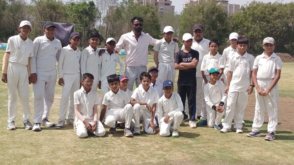 Group of young cricket players posing.